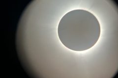 View of totality through the lens of the telescope.